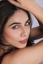 Stunning portrait of a woman showcasing delicate facial features and elegant makeup.